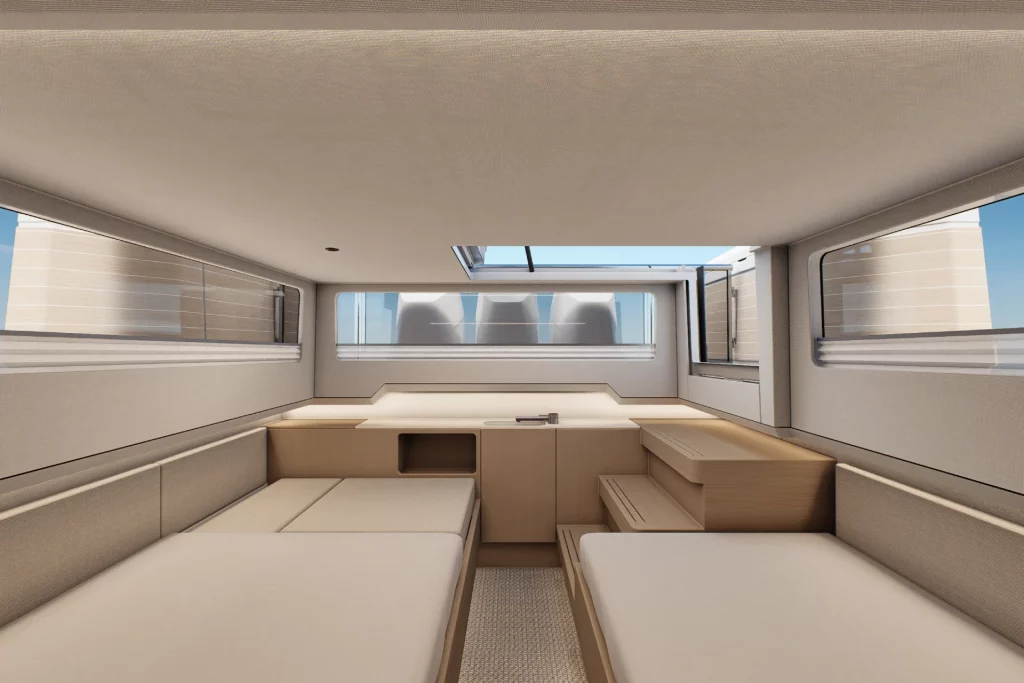 Dinette interna del Saxdor 460 GTS con letti singoli, piano di appoggio centrale e grandi finestre panoramiche.