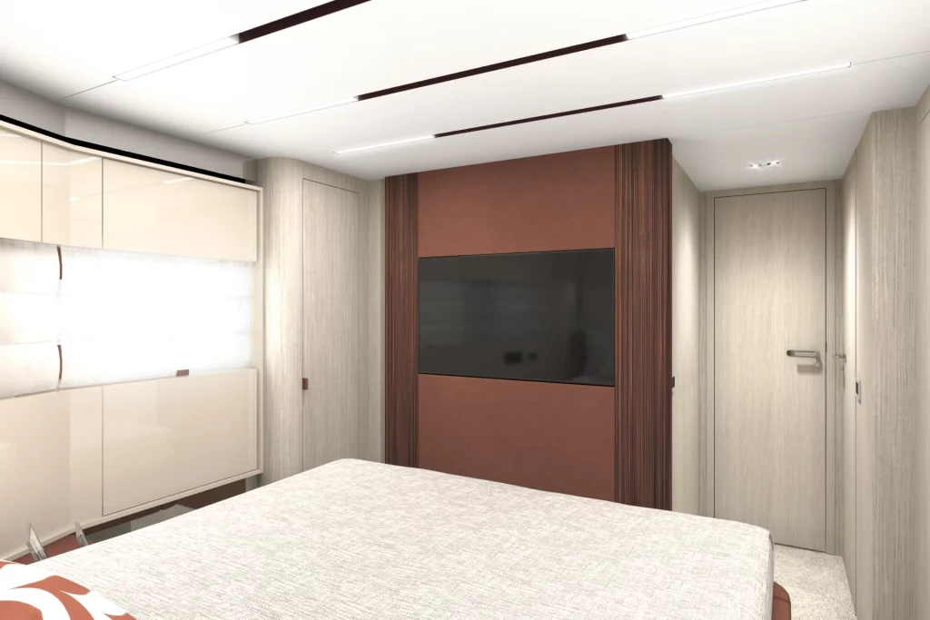 Cabina ospiti del Cranchi A64 con letto matrimoniale, televisore a parete, armadiature e illuminazione integrata.